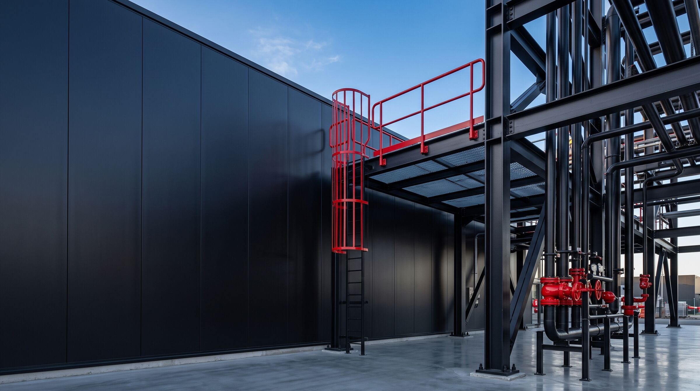 The same structure after coating, with black panels and bright red railings